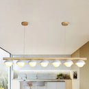 Modern wood stem linear chandelier with white shade dining room light