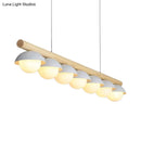 Modern wood stem linear chandelier with white shade dining room light