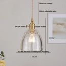 Modern yellow conical pendant light with copper knob for kitchens