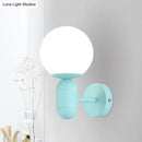 Modern yellow metal fixture wall lamp – kitchen frosted orb shade