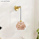 Modernist brass floral glass bulb bedside sconce light pink & clear