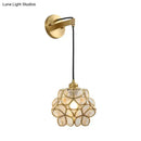 Modernist brass floral glass bulb bedside sconce light pink & clear
