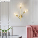 Modernist brass wall mount light fixture with prismatic glass bedroom