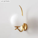 Modernist gold and white glass sconce light for bedroom