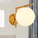 Modernist gold and white globe sconce light – bedroom wall lamp