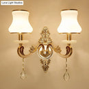 Modernist gold wall sconce with glass shade living room light