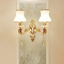 Modernist gold wall sconce with glass shade living room light