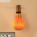 Modernist orange wood slat wall sconce – foyer bamboo lantern