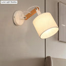 Modernist wood and fabric wall lamp – bedroom adjustable wood arm