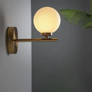 Nordic brass wall sconce light with glass globe – bedroom lighting