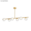 DecorBites™ Nordic Metal 6-Head Linear Island Light with Gold Finish and Clear Glass Globes