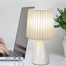 Orange ceramic milkshake bedside lamp with pleated shade for bedroom