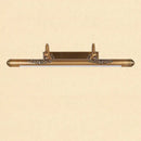 Ornate brass bathroom mirror lamp with decorative scrollwork
