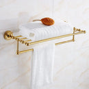 Ornate brass gold bathroom hardware set with towel rack and hooks