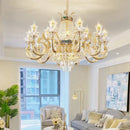 Ornate gold crystal dining room chandelier with green accent stone