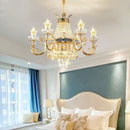 Ornate gold crystal dining room chandelier with green accent stone