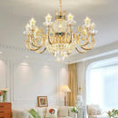 Ornate gold crystal dining room chandelier with green accent stone