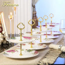 Ornate gold three tiered floral fruit plates set dining room stand