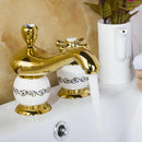 Ornate gold & white porcelain bathroom faucet set