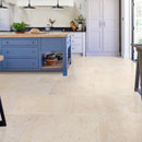 Otto beige marble 12x24 polished installed blue cabinet kitchen island view