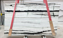 Panda White Bookmatching Marble Slabs Polished - Full Truckload one slab with red straps holding
