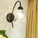 Post-modern black metal wall sconce with clear crystal shade bedroom