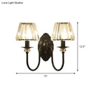 Post-modern black metal wall sconce with clear crystal shade bedroom