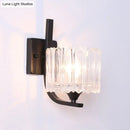 Post-modern black metal wall sconce with clear crystal shade bedroom