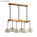 Post-modern gold metal finish island chandelier with clear glass kitchen