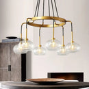 Post-modern gold metal finish island chandelier with clear glass kitchen