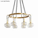 Post-modern gold metal finish island chandelier with clear glass kitchen