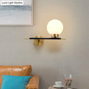 Post-modern white and brass sphere wall sconce bedroom light