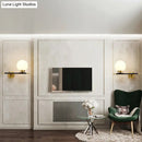 Post-modern white and brass sphere wall sconce bedroom light