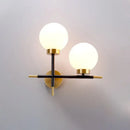 Post-modern white and brass sphere wall sconce bedroom light