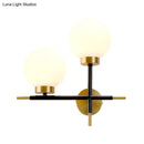 Post-modern white and brass sphere wall sconce bedroom light