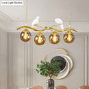 DecorBites™ Postmodern Iron Pendant Light with 4-Lights, Black/Gold Finish, Amber Ball Glass Shade, Bird Deco - Sprig Island
