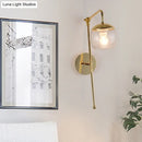 Postmodern black & gold swing arm wall sconce with clear glass bedroom light