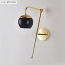 Postmodern black & gold swing arm wall sconce with clear glass bedroom light