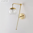 Postmodern black & gold swing arm wall sconce with clear glass bedroom light