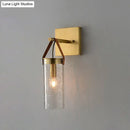 Postmodern brass wall sconce with clear crack glass and leather strap dining room light