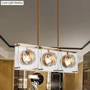 Postmodern gold and clear glass 3-light kitchen island light