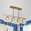 Postmodern gold and clear glass 3-light kitchen island light