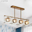 Postmodern gold and clear glass 3-light kitchen island light