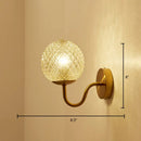 Postmodern gold ball shaped wall sconce with textured glass shade bedroom light