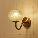 Postmodern gold ball shaped wall sconce with textured glass shade bedroom light