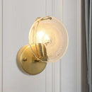 Postmodern gold metal wall sconce with clear glass shade bedroom light