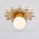 Postmodern gold sunburst ceiling light with cream glass shade bedroom