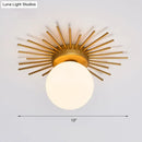 Postmodern gold sunburst ceiling light with cream glass shade bedroom