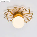 Postmodern gold sunburst ceiling light with cream glass shade bedroom