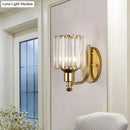 Postmodern gold wall lamp with prismatic crystal shade bedroom sconce